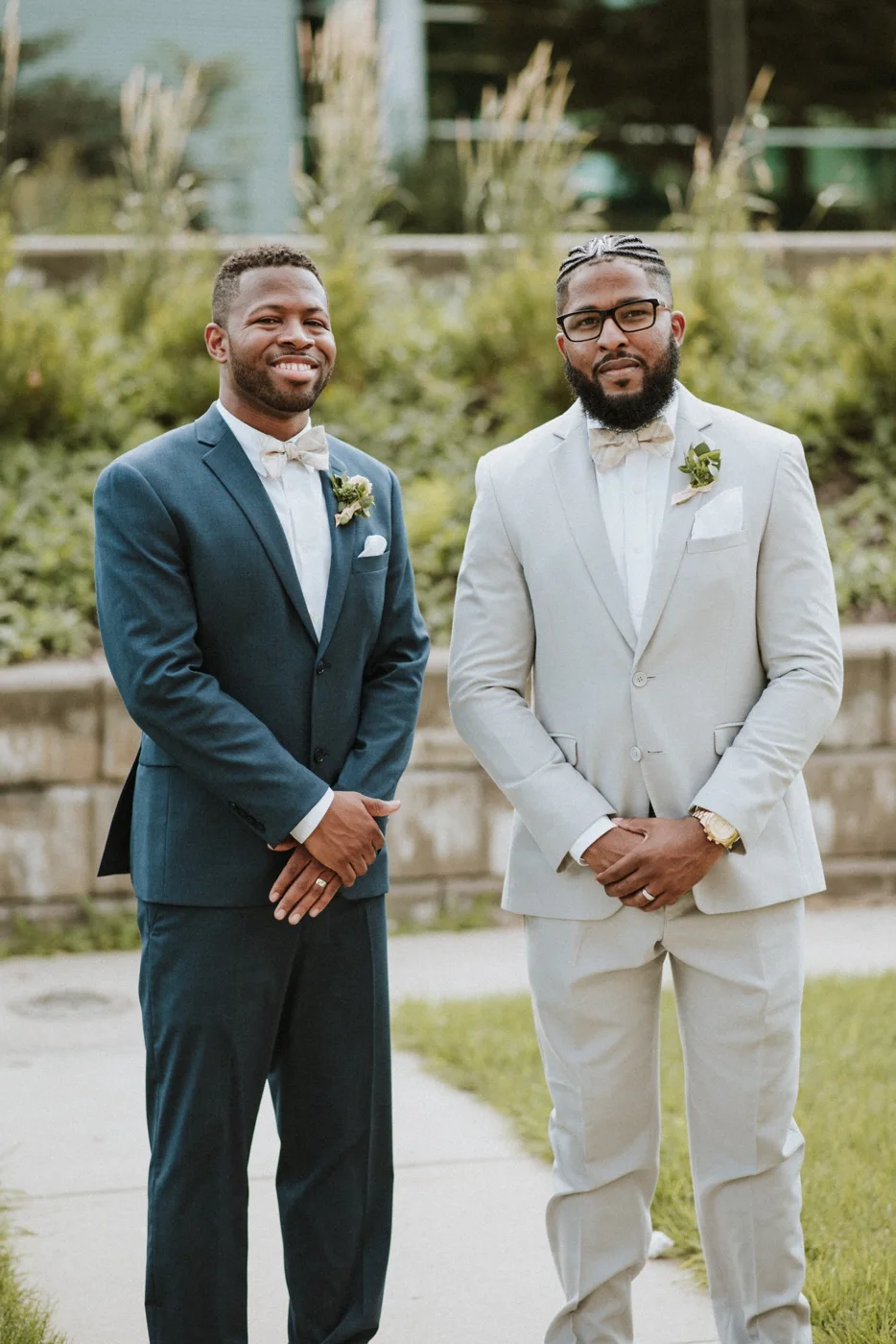 Sherman standing with a friend in formal attire
